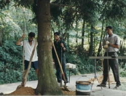 Friends dig fence post holes on the Rose farm