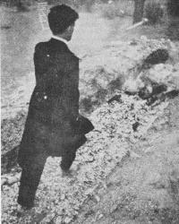 Photo of man walking over hot embers.
